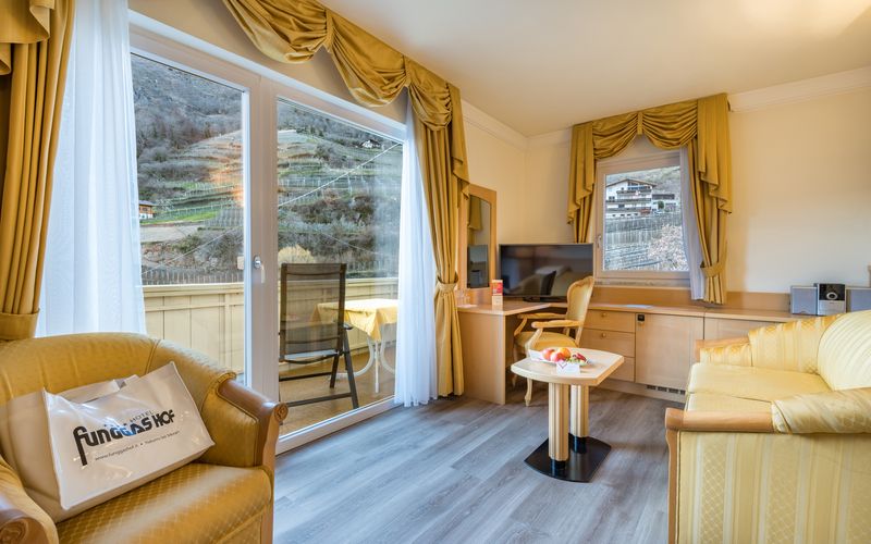 Sunny terrace with mountain view at Hotel Funggashof in Naturno, South Tyrol